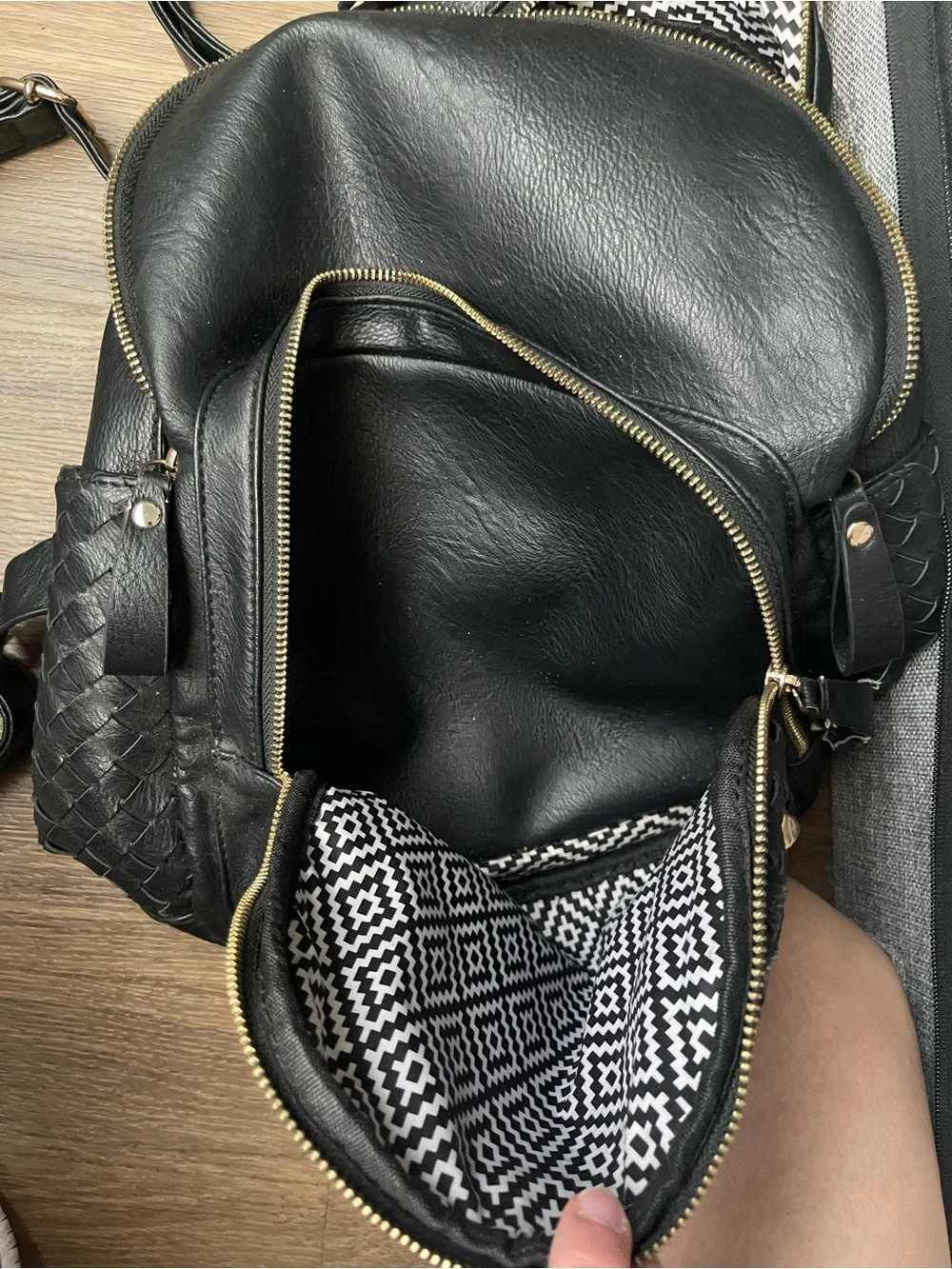 Woven Black Leather Backpack with Gold Accents